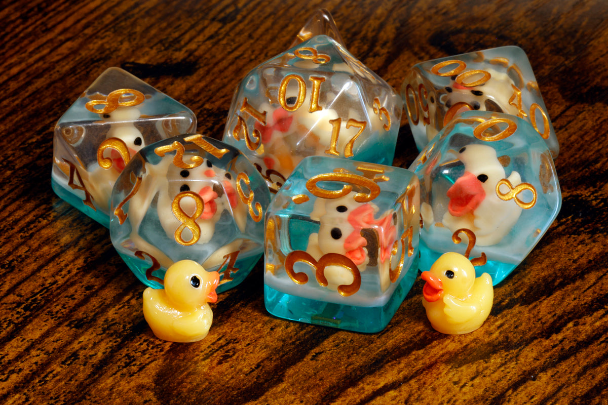 Yellow duck dice set with tiny duck inclusions - The Wizard's Vault