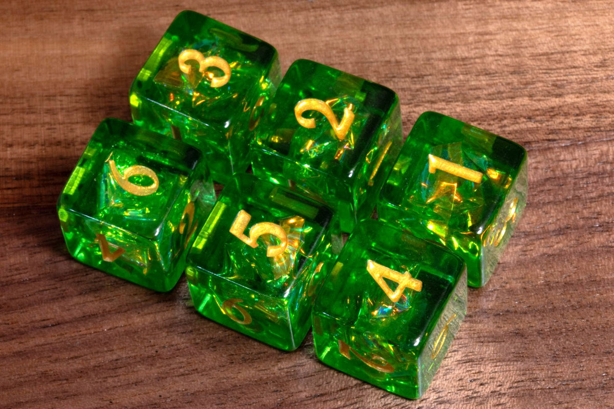 Six Canopy Opal D6 dice, bright green resin with holographic foil and gold numbers, on wood
