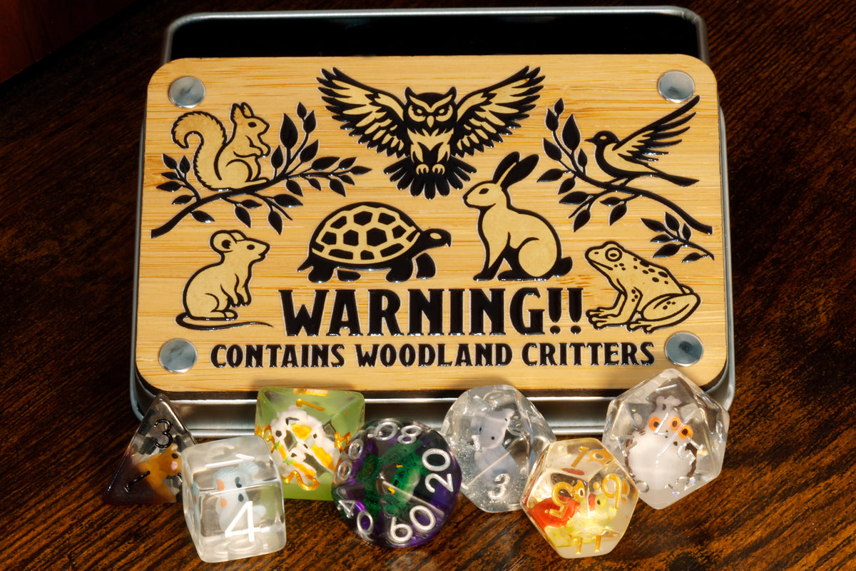 a wooden box with dices in it on a table