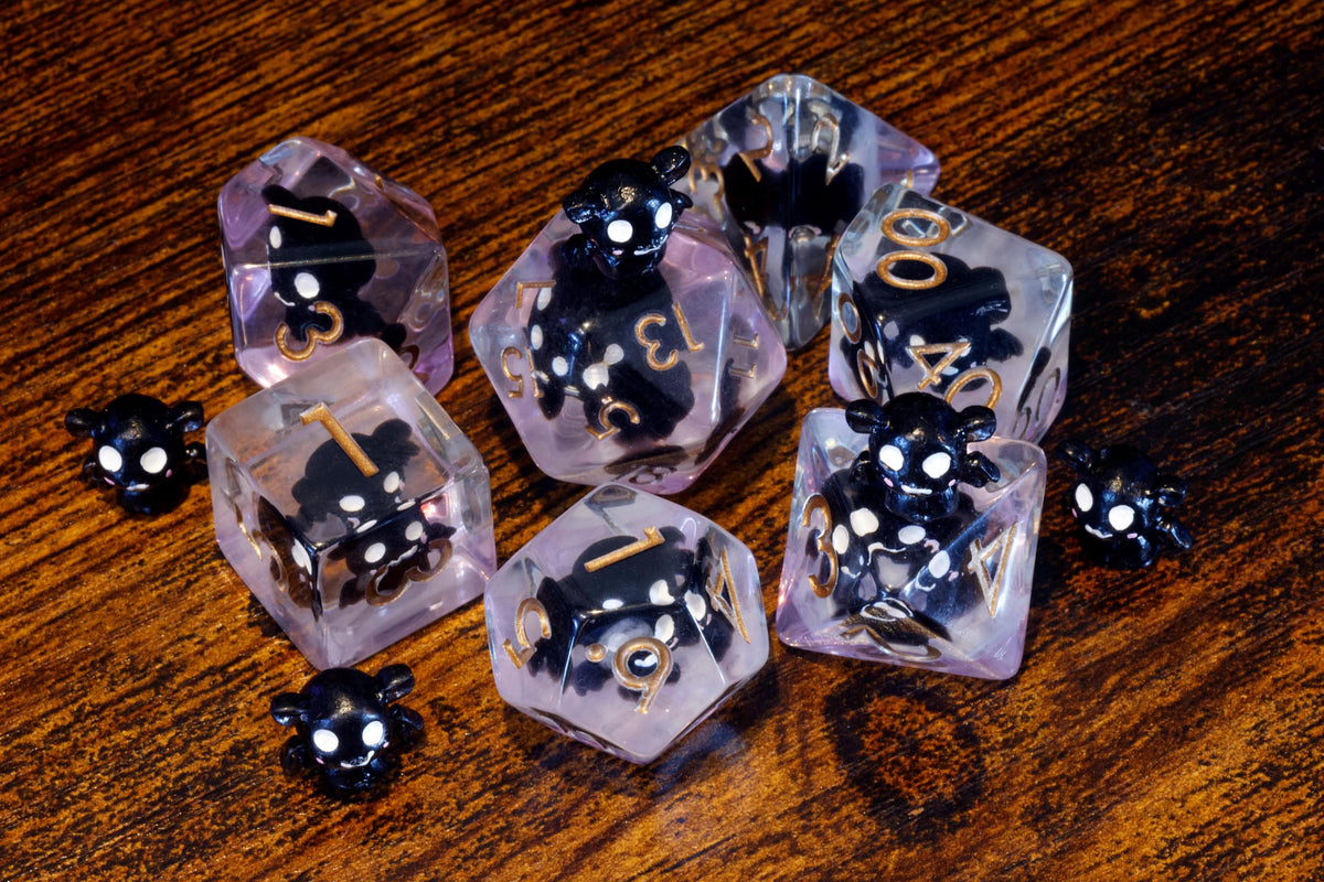 Bat polyhedral dice with miniature bat inclusions - The Wizard's Vault