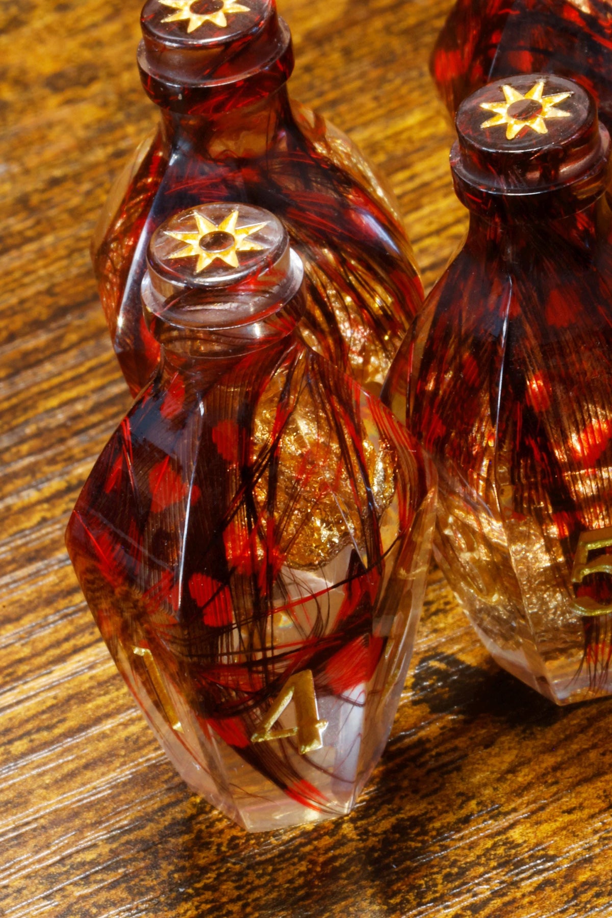 Gilded Phoenix Elixir D6 Potion Dice – Sharp Edge D6 - The Wizard's Vault