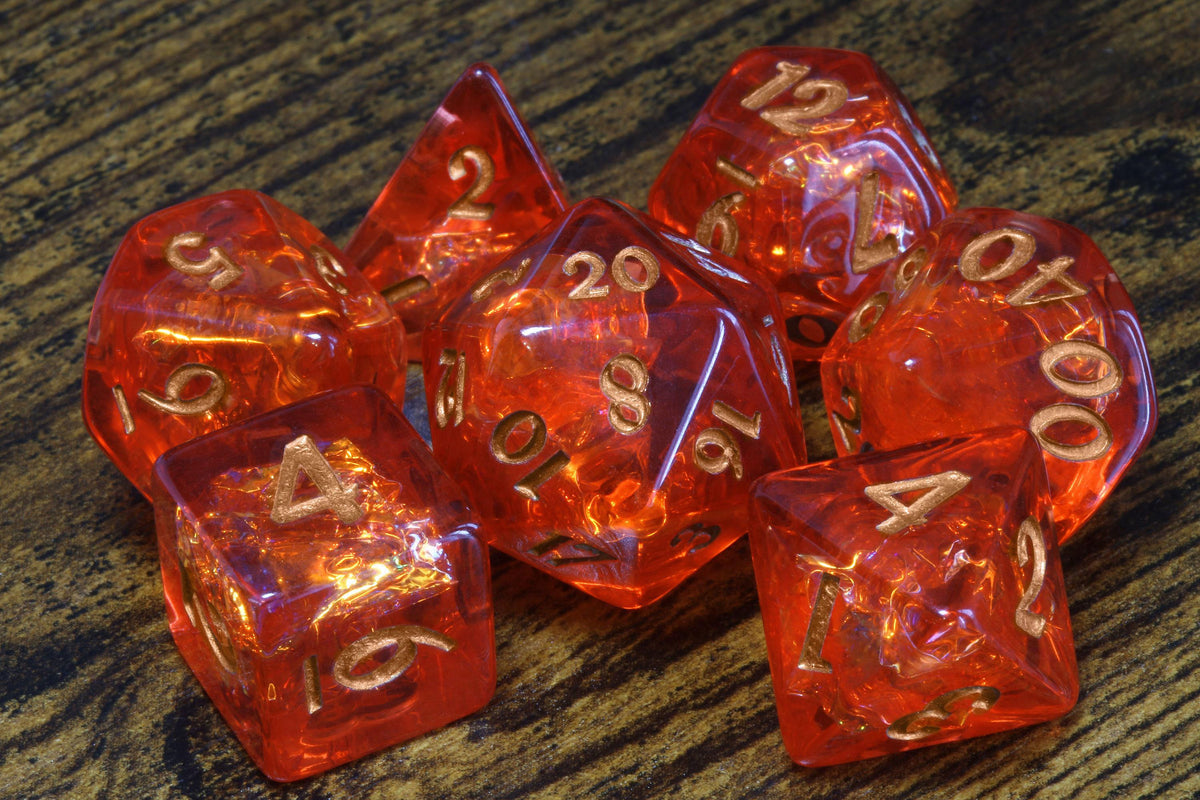 Fire Opal 7-Piece Dice Set – Transparent Red with Holographic Inclusions & Glitter - The Wizard's Vault