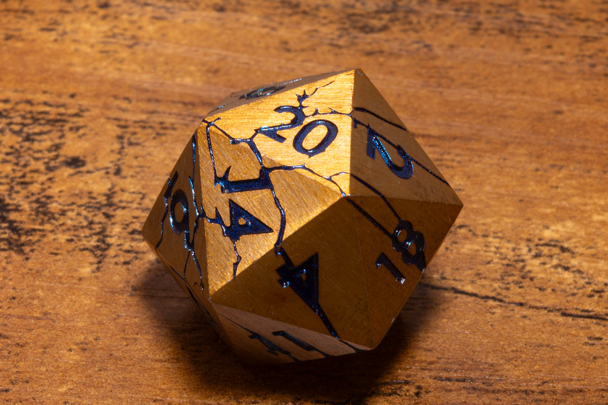 Glacier Shard Metal D20 – Gold with Blue Cracks