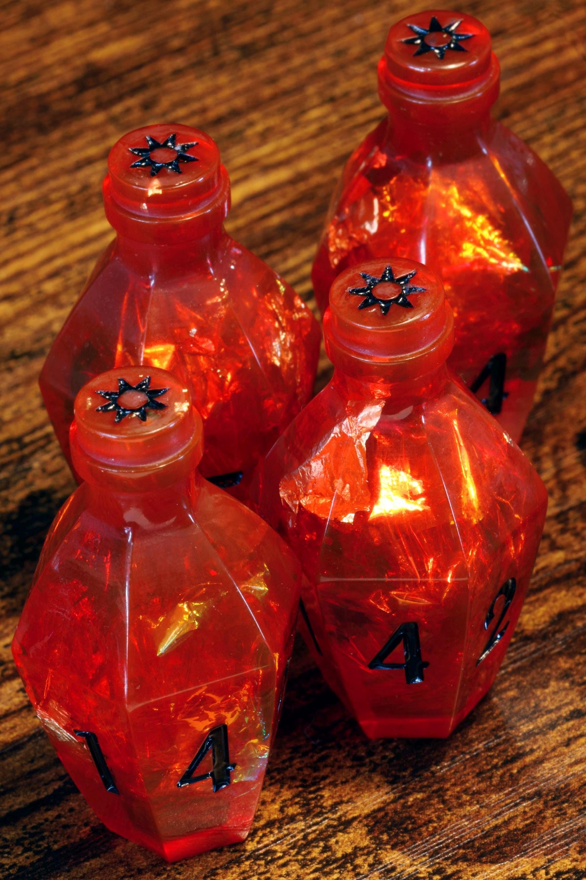 Vampire's Kiss Elixir D6 Potion Dice – Red Sharp Edge with Holographic Foil and Gold Flakes - The Wizard's Vault