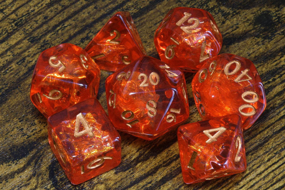 Fire Opal 7-Piece Dice Set – Transparent Red with Holographic Inclusions & Glitter - The Wizard's Vault