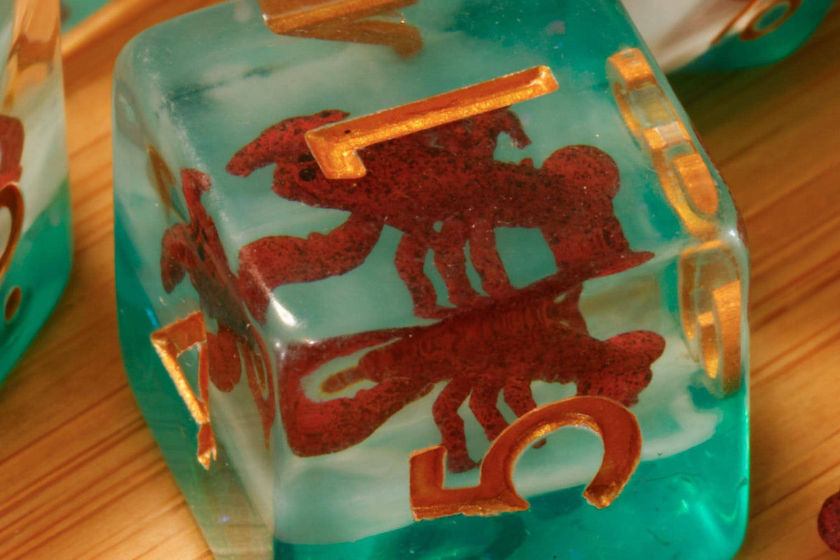 Close view of lobster inclusion polyhedral dice