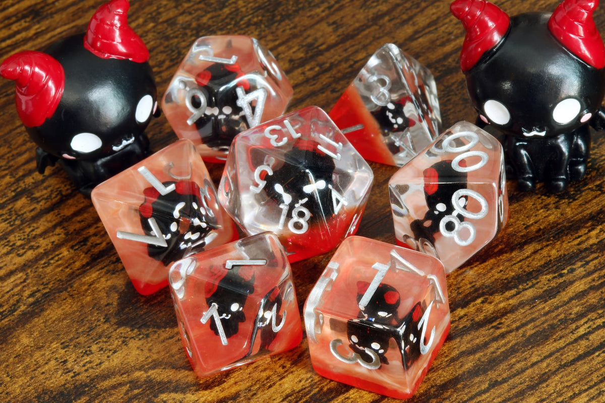 Demonic Cat dice set - Dice set with winged cats on an orange layer - The Wizard's Vault
